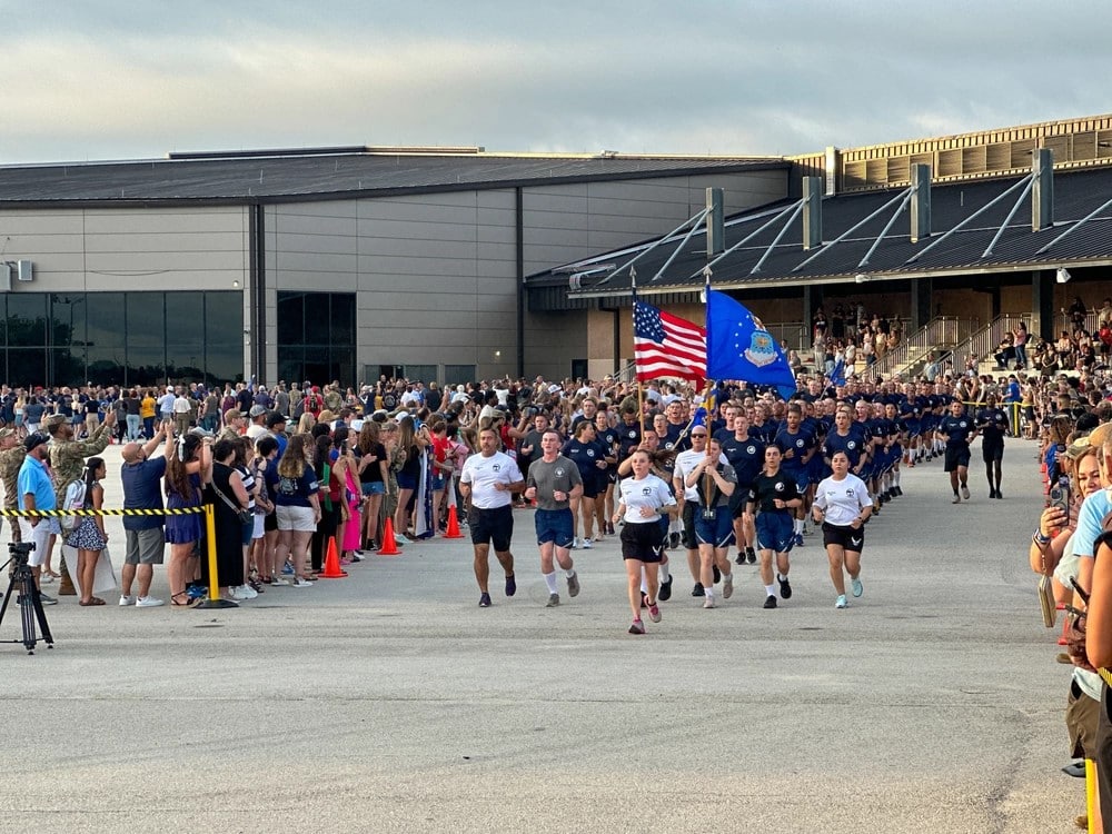 Airman’s Run at BMT graduation, showing Airmen running in formation at Lackland AFB.