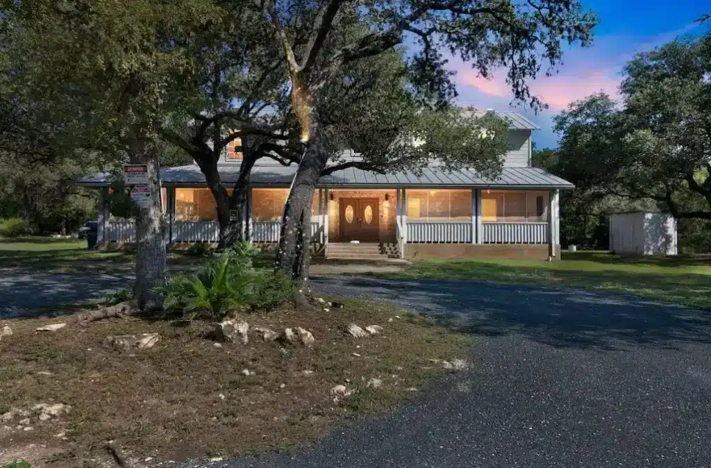 Front view of a peaceful farmhouse rental near Lackland AFB, perfect for TLE lodging and BMT graduation visitors.