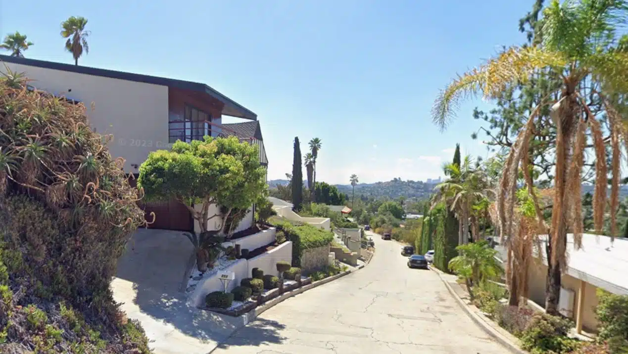 Scenic hillside street in Glendale, California with modern homes, palm trees, and city views, representing Los Angeles veteran-friendly areas.